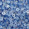 A close-up view of flat-back transparent iridescent acrylic pearls in various sizes, intended for use as embellishments.