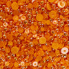 A close-up view of orange zest acrylic flat-back baubles embellishment mix.