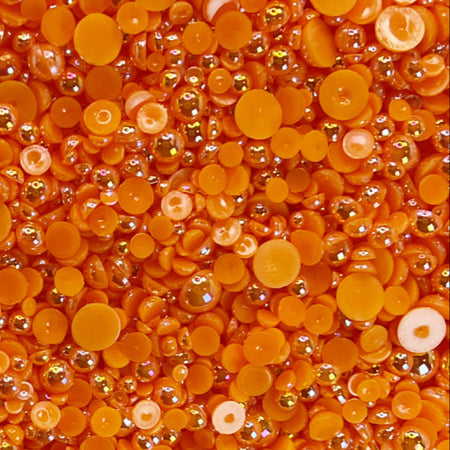 A close-up view of orange zest acrylic flat-back baubles embellishment mix.