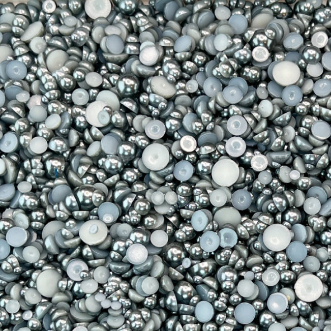 A close-up view of black pearl acrylic flat-back baubles embellishment mix.