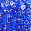 A close-up image of blue iridescent bauble embellishments from Trinity Stamps, labeled as 'Illuminating Indigo Iridescent Blue Bauble Embellishment Mix'.