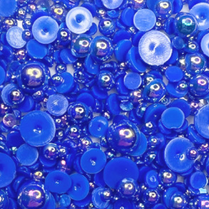 A close-up image of blue iridescent bauble embellishments from Trinity Stamps, labeled as 'Illuminating Indigo Iridescent Blue Bauble Embellishment Mix'.