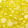 A close-up image of yellow satin bauble embellishments from Trinity Stamps, used for crafting and decoration.
