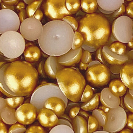 A collection of gold satin flat-back acrylic pearls of various sizes arranged densely together.