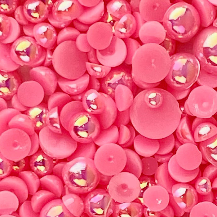 A close-up of pink and magenta acrylic flat-back baubles embellishments, with a label indicating 'Flashy Flamingo' and the brand website.